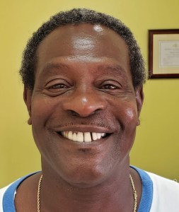 Picture of a man smiling for the smile gallery before treatment