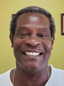 Picture of a man smiling for the smile gallery after  treatment