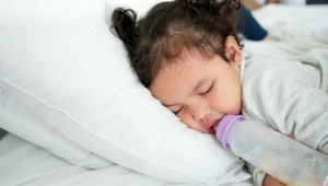 toddler sleeping with bottle in mouth
