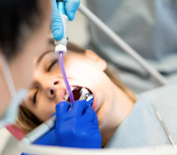 adult female under anesthesia for dental procedure
