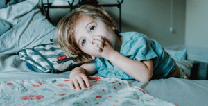 young child sucking thumb